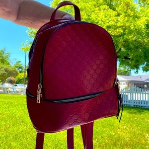 red heart stitched backpack